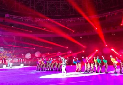 Cirque Éloize performers take the stage at the men's handball championship, with red and purple lights flooding the stage