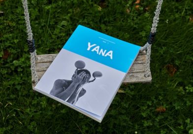 A YANA booklet lays on a swing