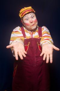 Michael Jay Garner, circus clown in Kooza extends his hands