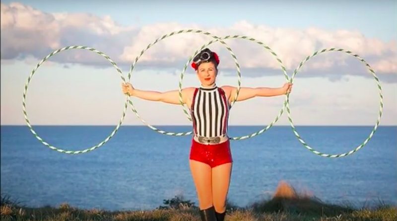 Emma Khourey holding four hula hoops
