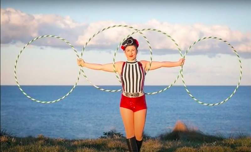 Emma Khourey holding four hula hoops