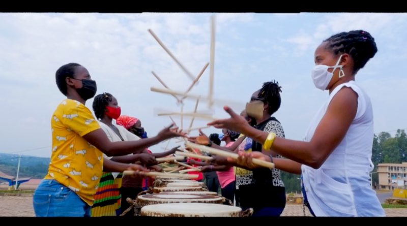 Ingoma Nyasha members juggling drumsticks