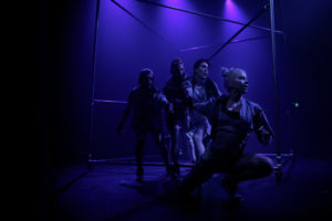 Masha Terentieva onstage under blue lighting