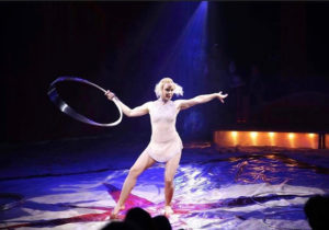 Finnish circus performer Veera Kaijanen stands in a circus ring with her hula hoop