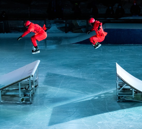 In CADENCE, ice-skating and circus show, two ice-skating performers leap from one ramp to another in the rink