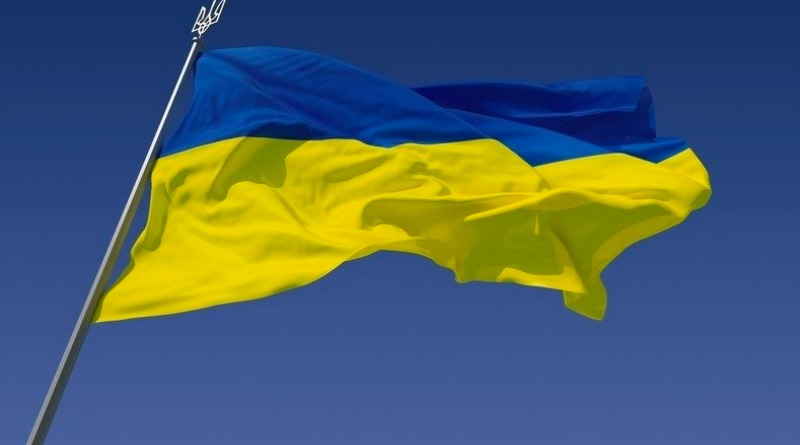 a Ukrainian flag blows in the wind