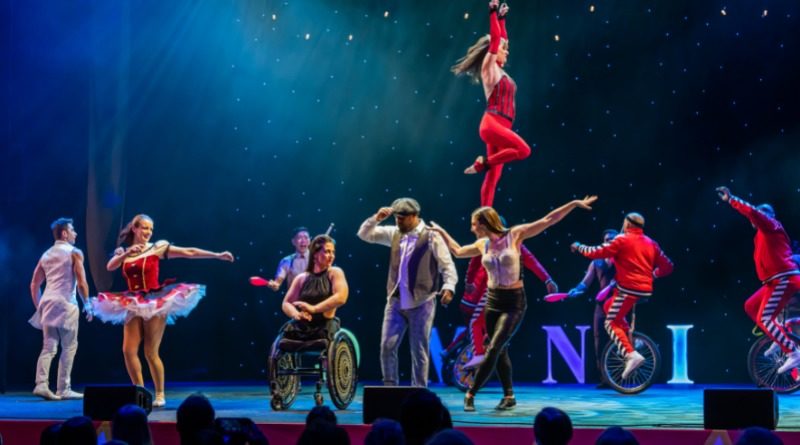 Omnium Circus cast, including Jen Bricker-Bauer, the Espana family, dance together on stage in "I'mPossible,"