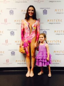 In costume from Cirque du Soleil's Mystique, Ginger Griep-Ruiz smiles in a picture with her daughter
