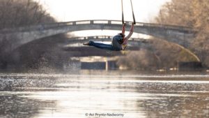 Under the Rochester Bridge, Julia Baccellieri, Black circus performer, flies on their dance trapeze