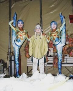Childhood picture of performer Ulzii Mergen Kee, posed with two other Mongolian acrobats