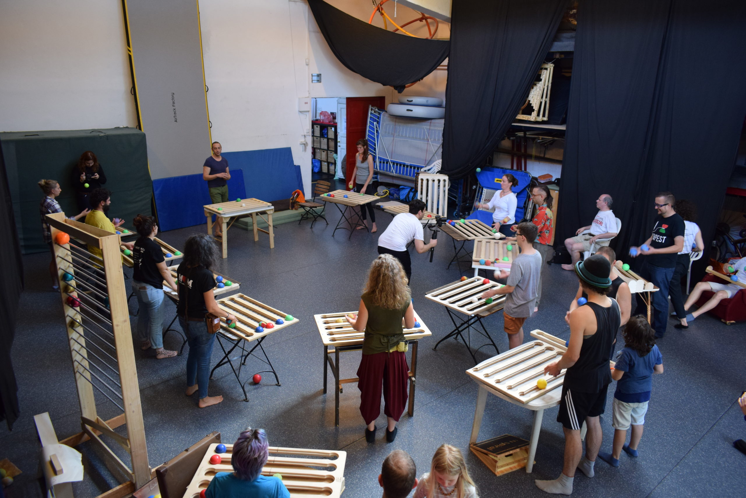 Circle of functional juggling boards in INspiral Circus Center classroom. This circle of international jugglers are attendees at the first Functional Juggling Convention