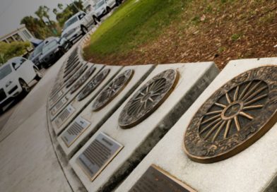 Circus Ring of Fame plaques to notable figures in the circus world. The plaques are laid out on a ring-shaped path beside a grassy field and parking lot