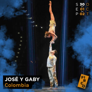 Colombian hand to hand acrobats Jose y Gaby, a male and female duo act, touch hands 