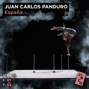 Spanish circus artist Juan Carlos Panduro performs a hand stand while on stilts 