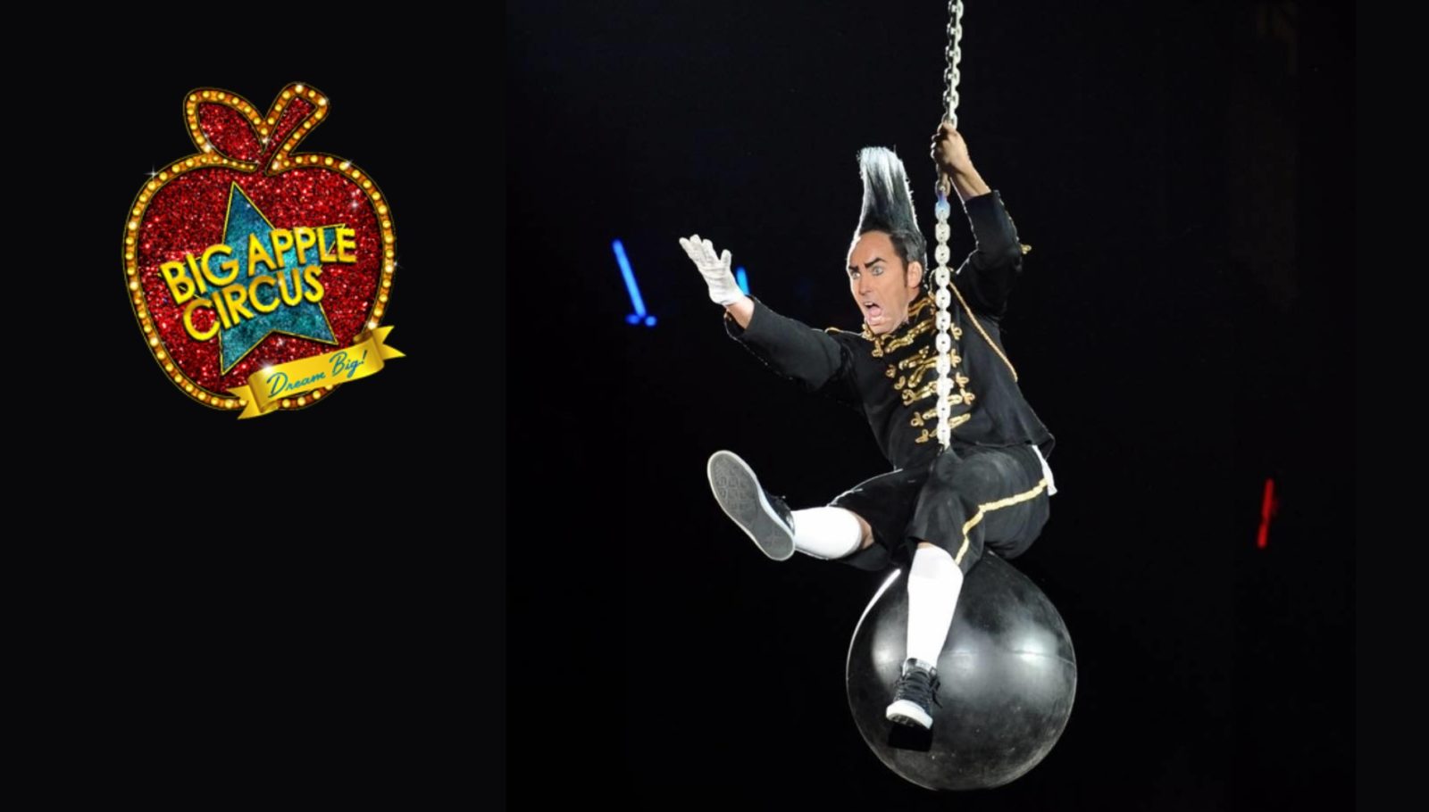 Comedian and daredevil Johnny Rocket rides on a wrecking ball to greet Big Apple Circus audiences
