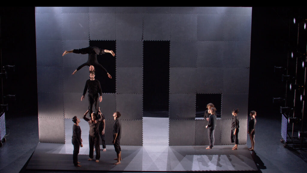 In the Bestia company circus show Barriere, acrobats perform around an abstract wall structure