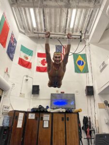 Trapezist Jerry Estefano Navas practices flying in a circus studio