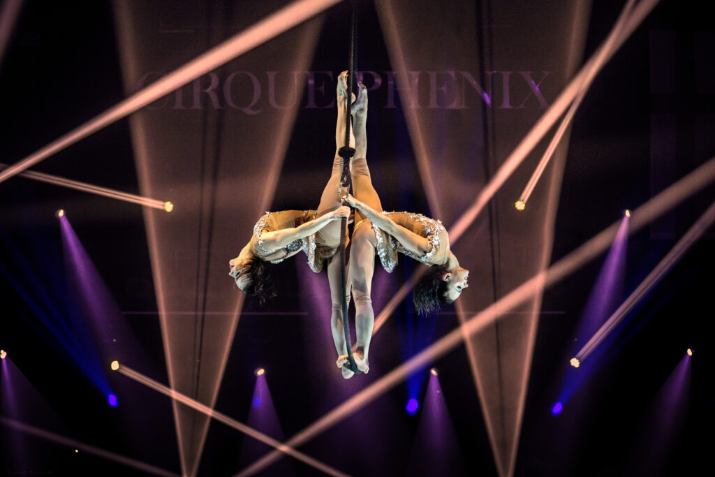 Twin Ukrainian gymnasts Yiuliia and Olha Mosiienko, as Duo Gemini, perform a mirrored circus act on flying poles