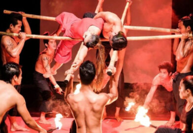 Phare Ponleu Selpak acrobats perform an act with horizontal bars and fire