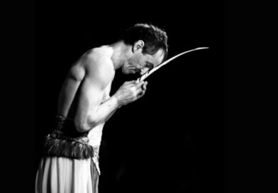 Swiss performer Martin "Mädir" Eugster of the Rigolo Circus does a balancing act with a long, thin blade