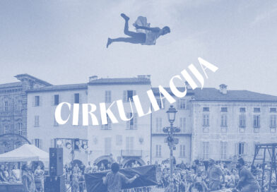 A circus artist flies above the audience outdoors at the Cirkuliacija Contemporary Circus