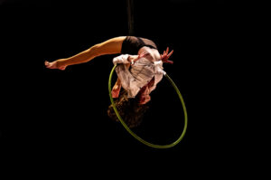 Aerialist Kalista Russell performs a back-bend in a Lyra aerial hoop