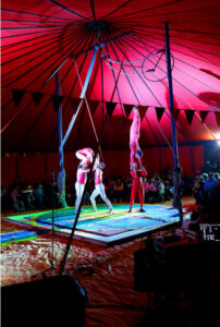 Five acrobats from the Circo Hermanos Castro perform a balance act on a small platform