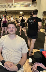 Australian man Lachlan Binns of circus company Gravity and Other Myths joins other acrobats clad in workout attire for a casting jam at Montreal's Kalabanté Productions studio.